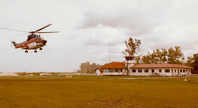Lutong Airstrip circa 1970s - note the grass strip runway, photo needs proper credit.